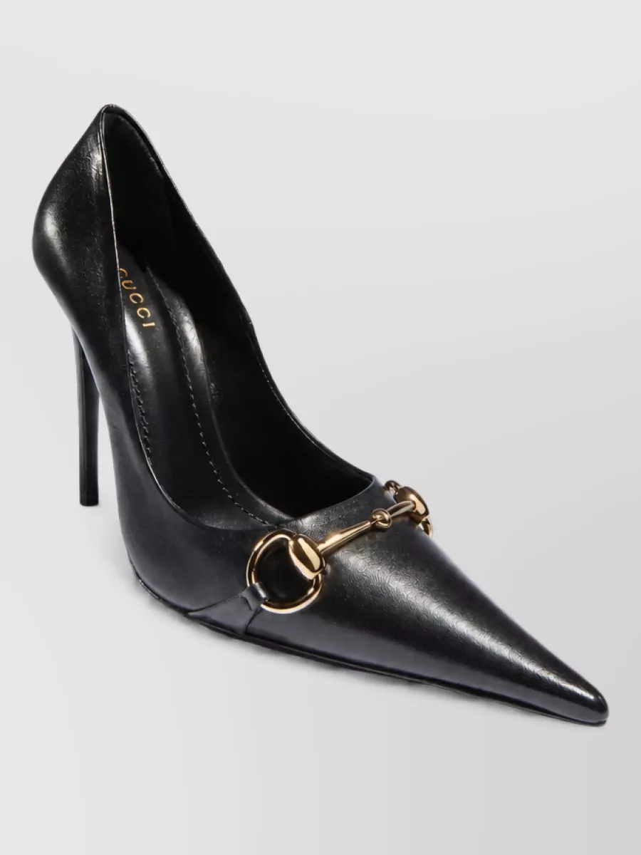 Gucci Leather point-toe high-heel pumps — The pointed stiletto pump sharpens the tailored trouser and keeps the head-to-toe black story sleek and formal for desk-to-dinner dressing.