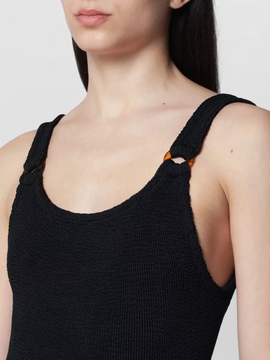 Hunza G One-shoulder swimsuit — The Hunza G black one-piece mirrors the sandal’s minimalist sport energy and spring-summer ease, creating a clean monochrome swim base that can read as both beachwear and sleek bodysuit.