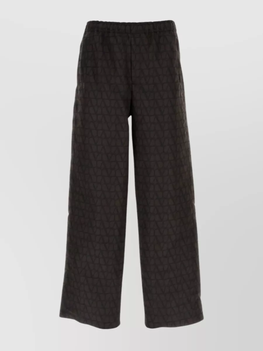 Shop Valentino Elasticated Waistband Geometric Wide-leg Trousers In Black
