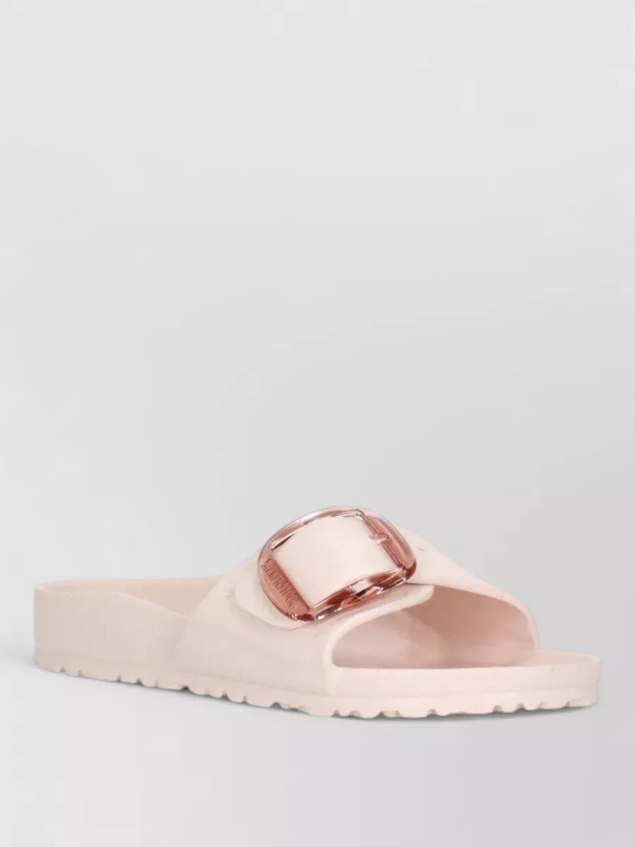Birkenstock Eva flat sandals — The blush Birkenstock-style slides introduce a gentle, boho-leaning note while remaining minimalist and refined, pairing naturally with airy white broderie trousers and the satin tee.