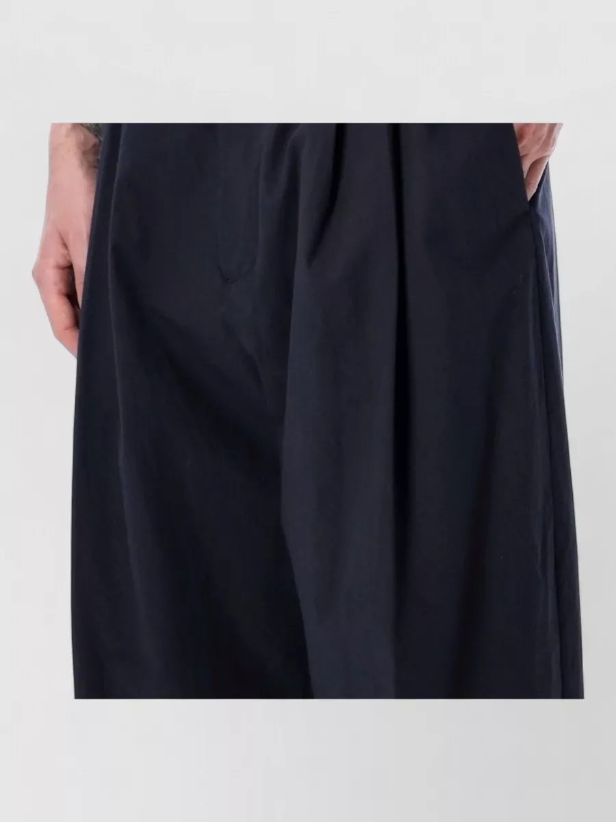 Studio Nicholson Pleated Wide-Leg Trousers