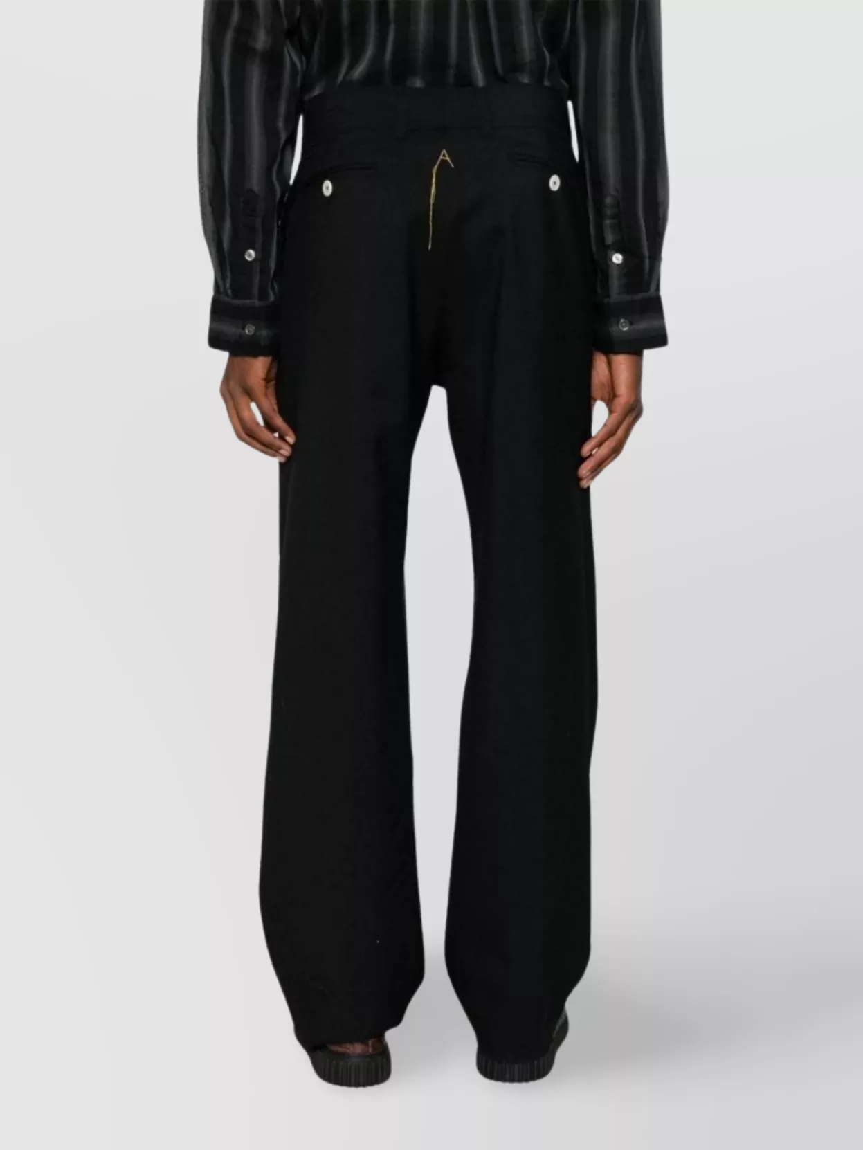 Airei Wool Trousers Featuring Exposed-seam Detailing In Black