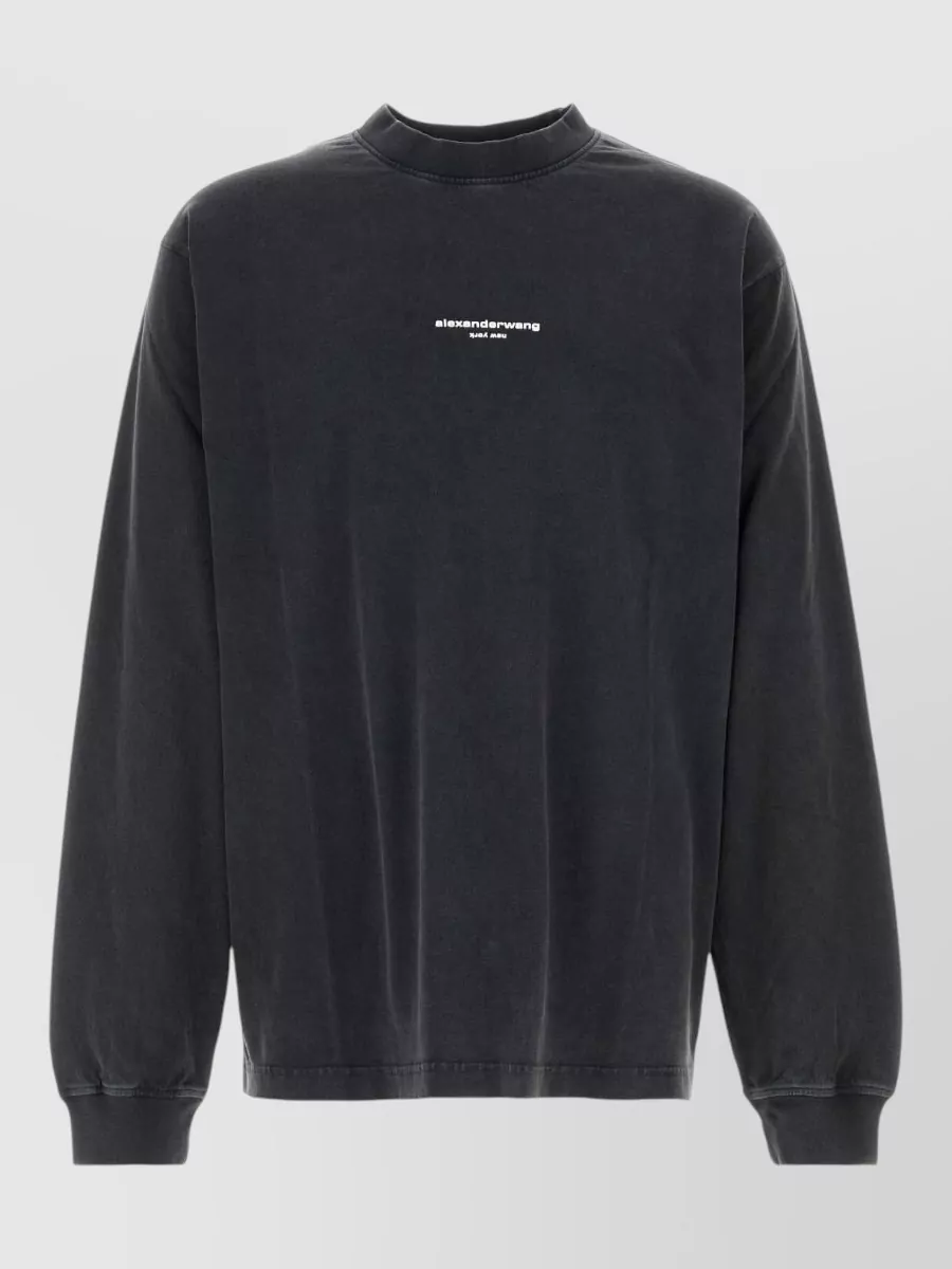 Alexander Wang Cotton oversized long-sleeve logo t-shirt — The cropped charcoal hoodie mirrors the pant’s color and logo language while cropping at the waist to balance the relaxed wide-leg and keep the set streetwear and proportionally sharp.