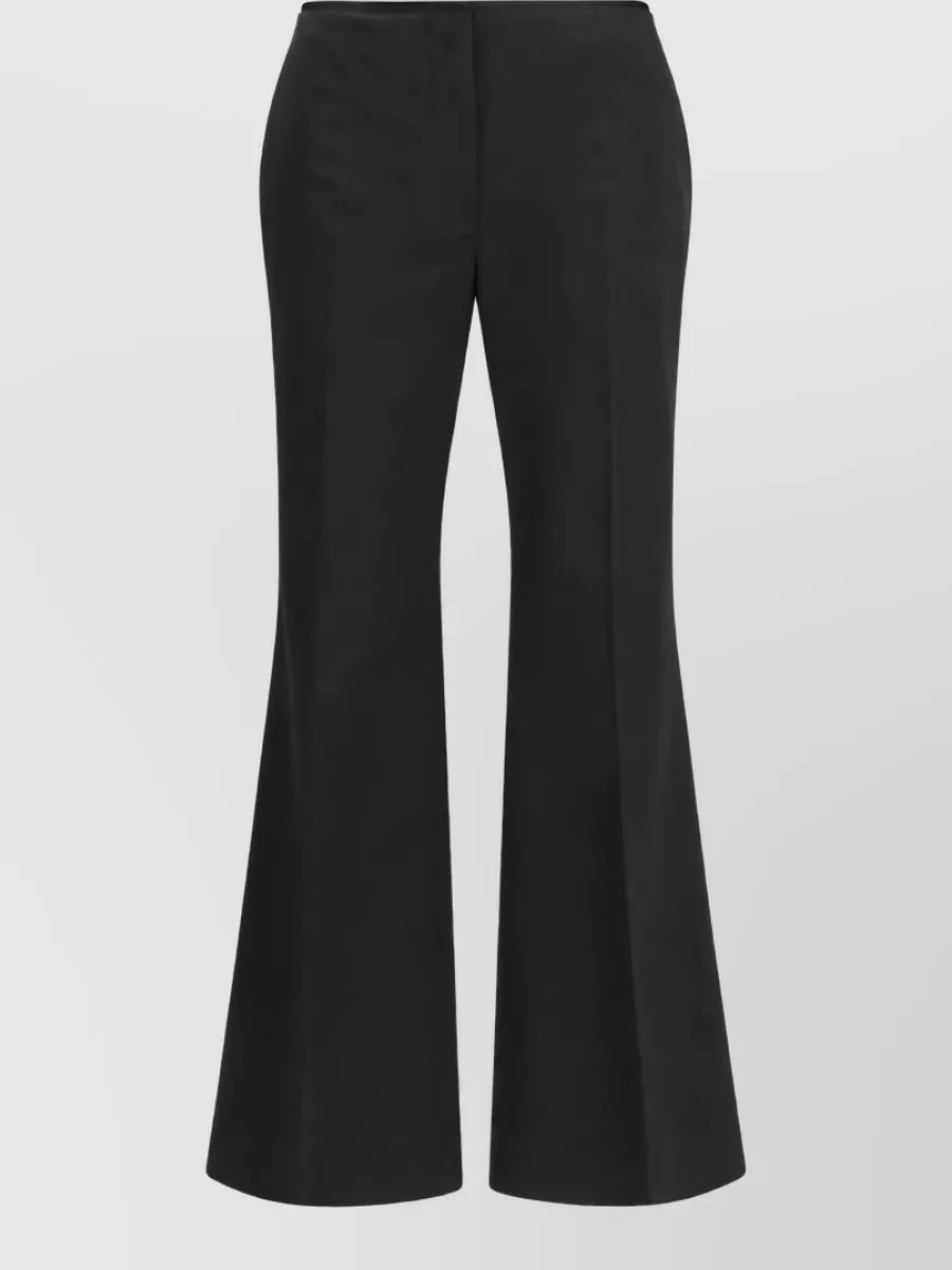 Totême raw-edge flared trousers