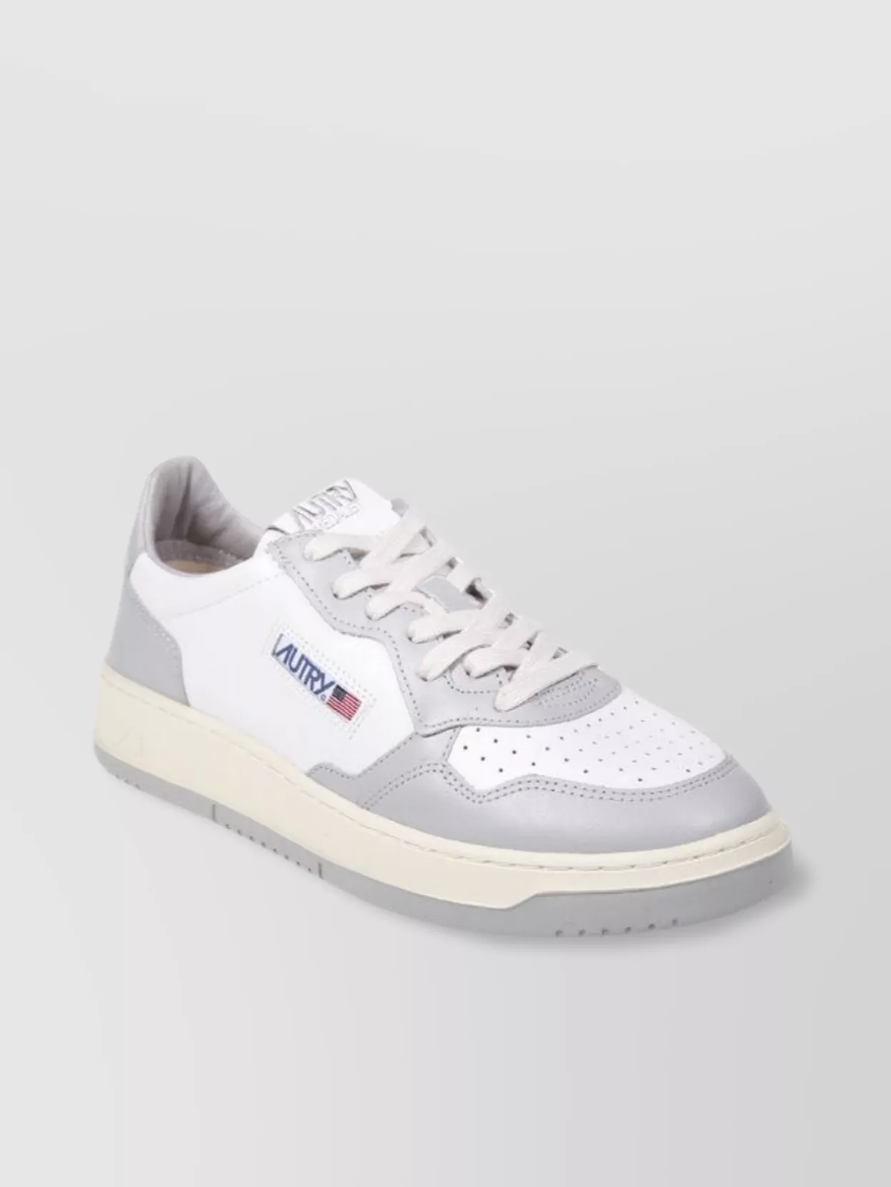 Autry Low Sneaker With Contrast Sole And Perforated Toe