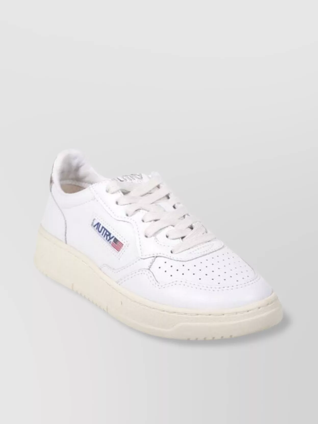 Autry Low Top Rubber Sole Sneaker With Perforated Detailing In White