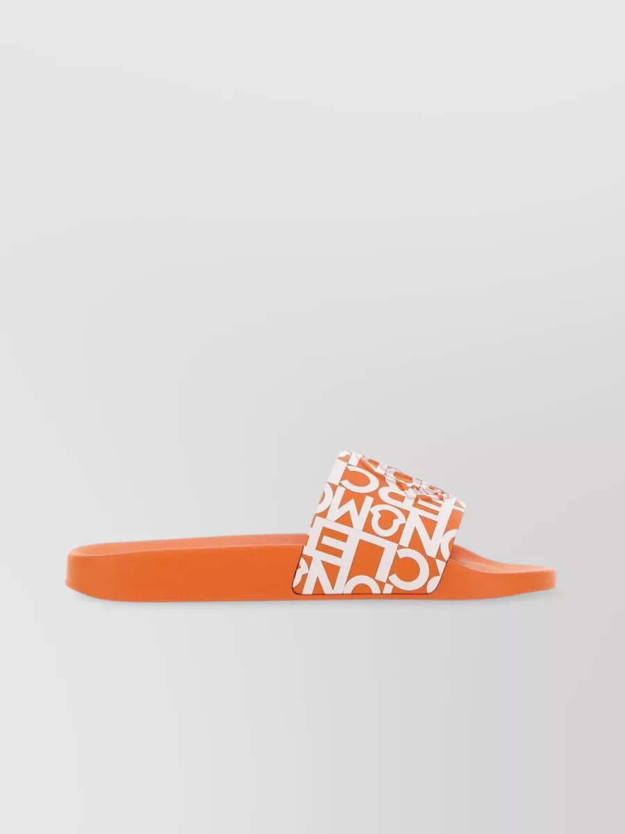 Shop Moncler Round Toe Flat Sole Jeanne Rubber Slippers In Orange