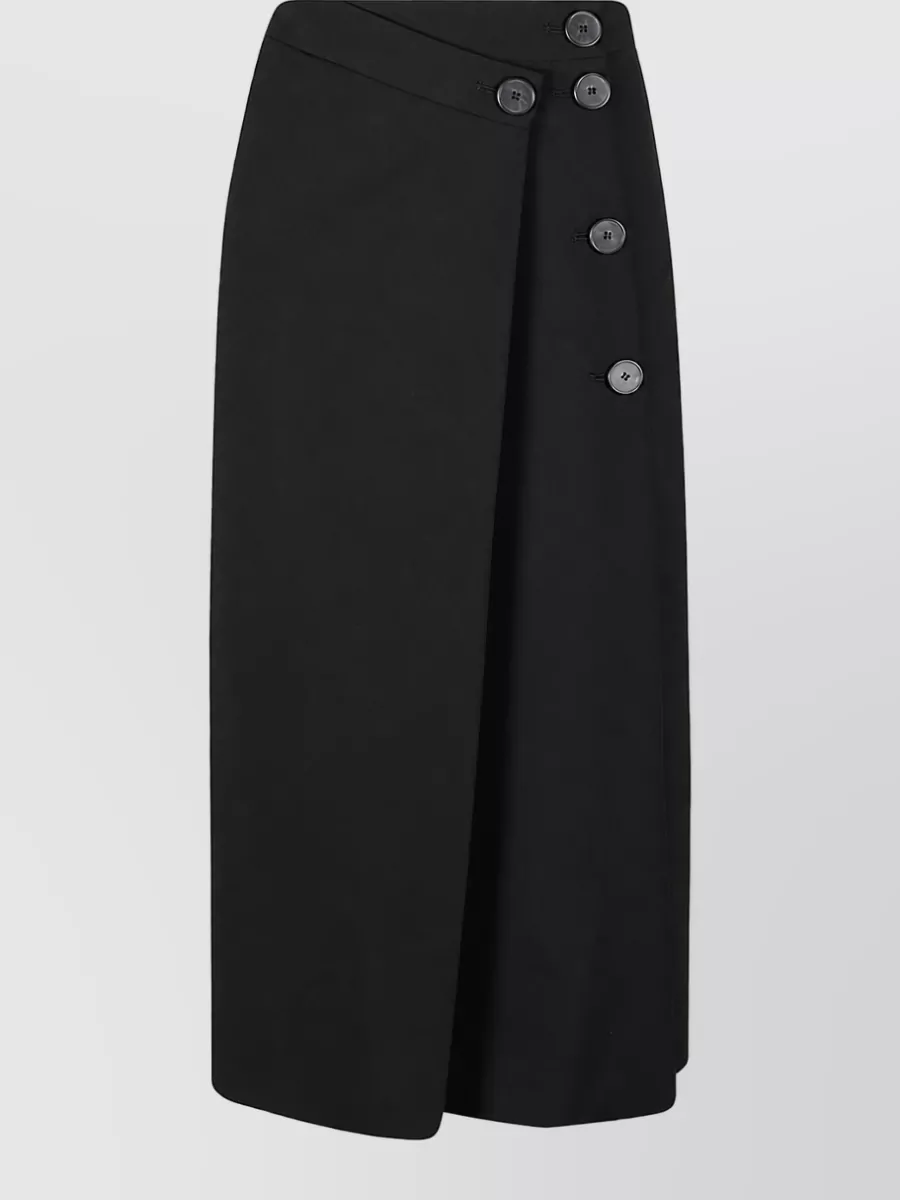 Iro High-rise trousers — The black Iro wrap midi skirt mirrors the source piece’s architectural minimalism and formality, creating a sleek, elongated line that grounds the bodysuit for city-ready quiet luxury.