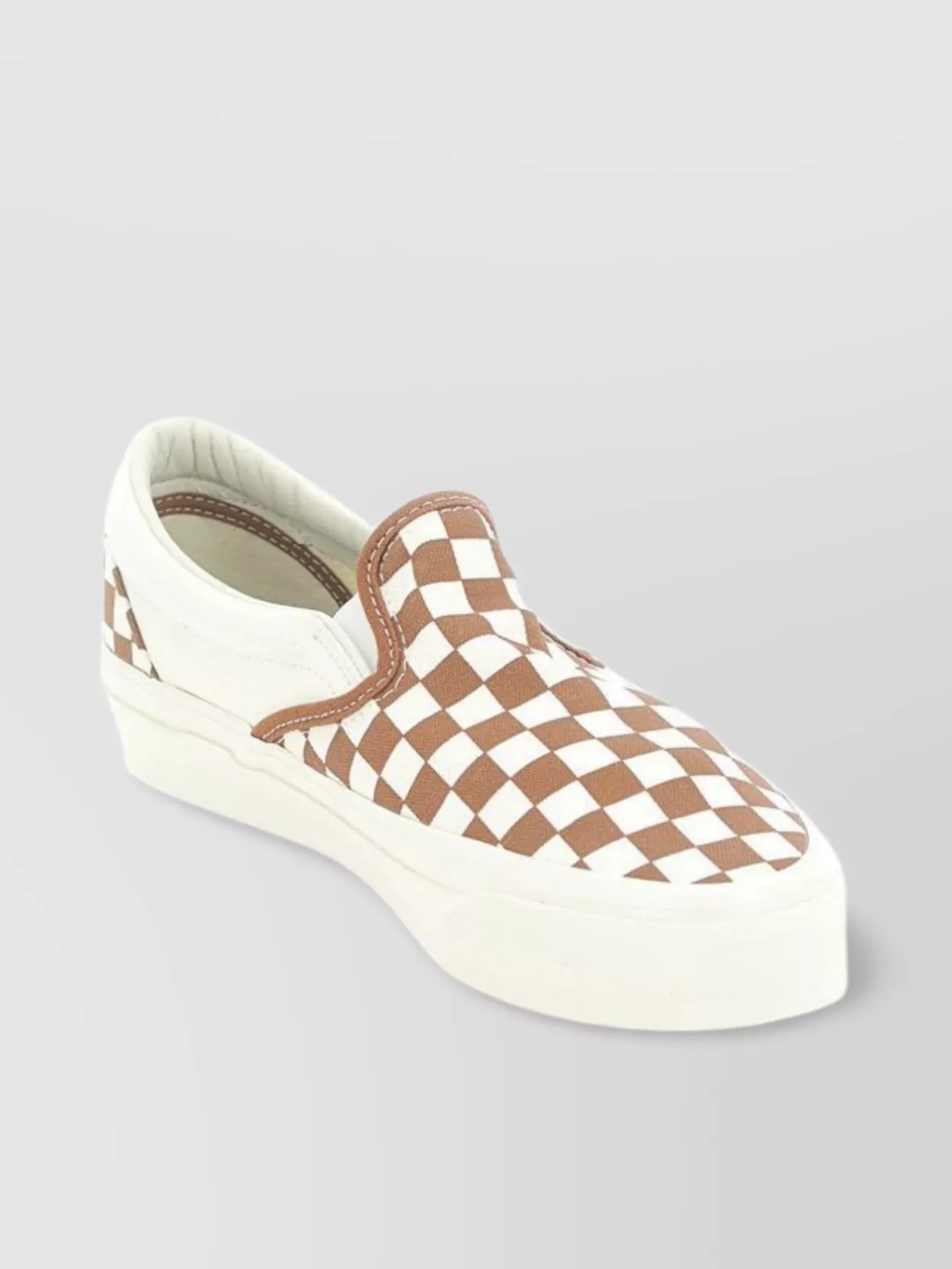 Shop Vans Slip-on Checkered Pattern Sneakers