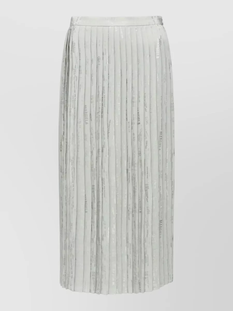 Mm6 Maison Margiela Pleated skirt — The high-rise ivory wide leg mirrors the shirt’s relaxed tailoring and soft stripe, creating a light, elongated column that feels quietly polished for warm weather.
