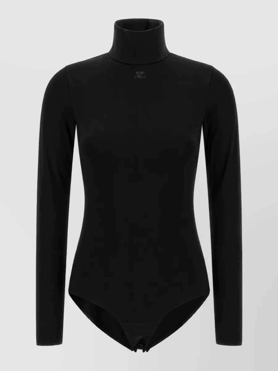 Courrèges Viscose mockneck long-sleeve bodysuit — The second-skin black turtleneck bodysuit mirrors the leggings’ sculpted fit and minimal sport-tech attitude, creating a clean, uninterrupted Courrèges column that feels sharp and winter-appropriate.