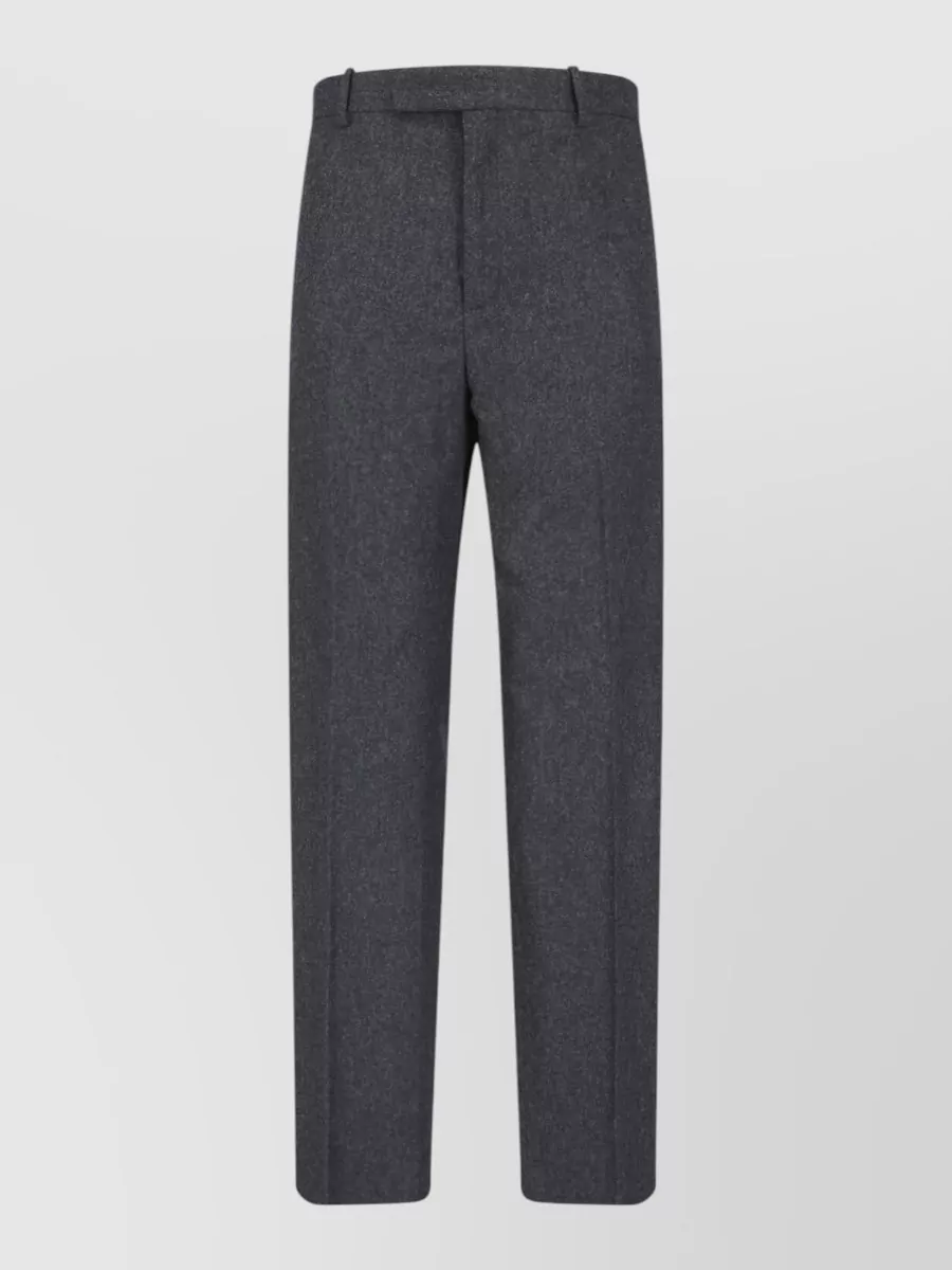 Jil Sander Wool straight-leg trousers — The charcoal wool trouser in F matches the tee’s charcoal ground and quiet stripe, keeping the palette tonal and formality smart-casual with a clean straight leg that suits the regular tee silhouette.