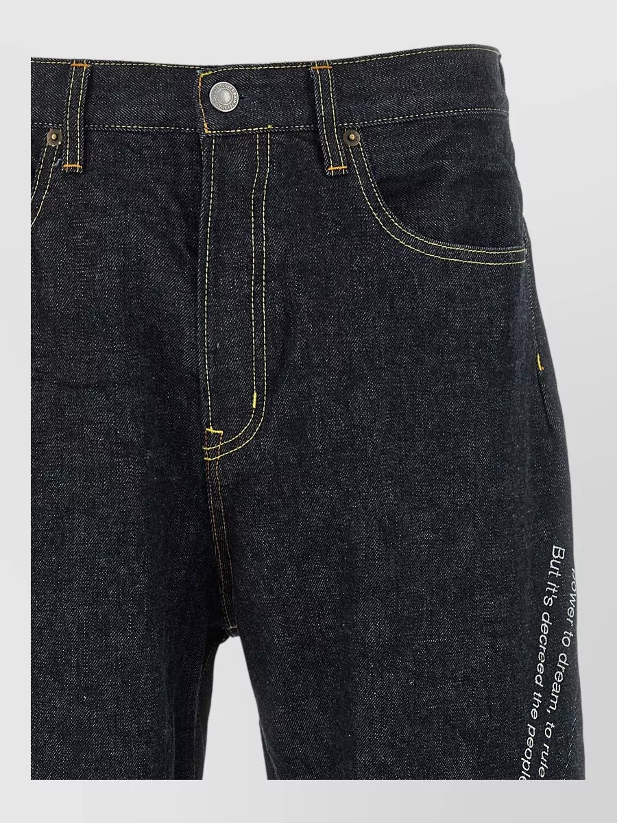 Undercover wide-leg embroidered denim jeans