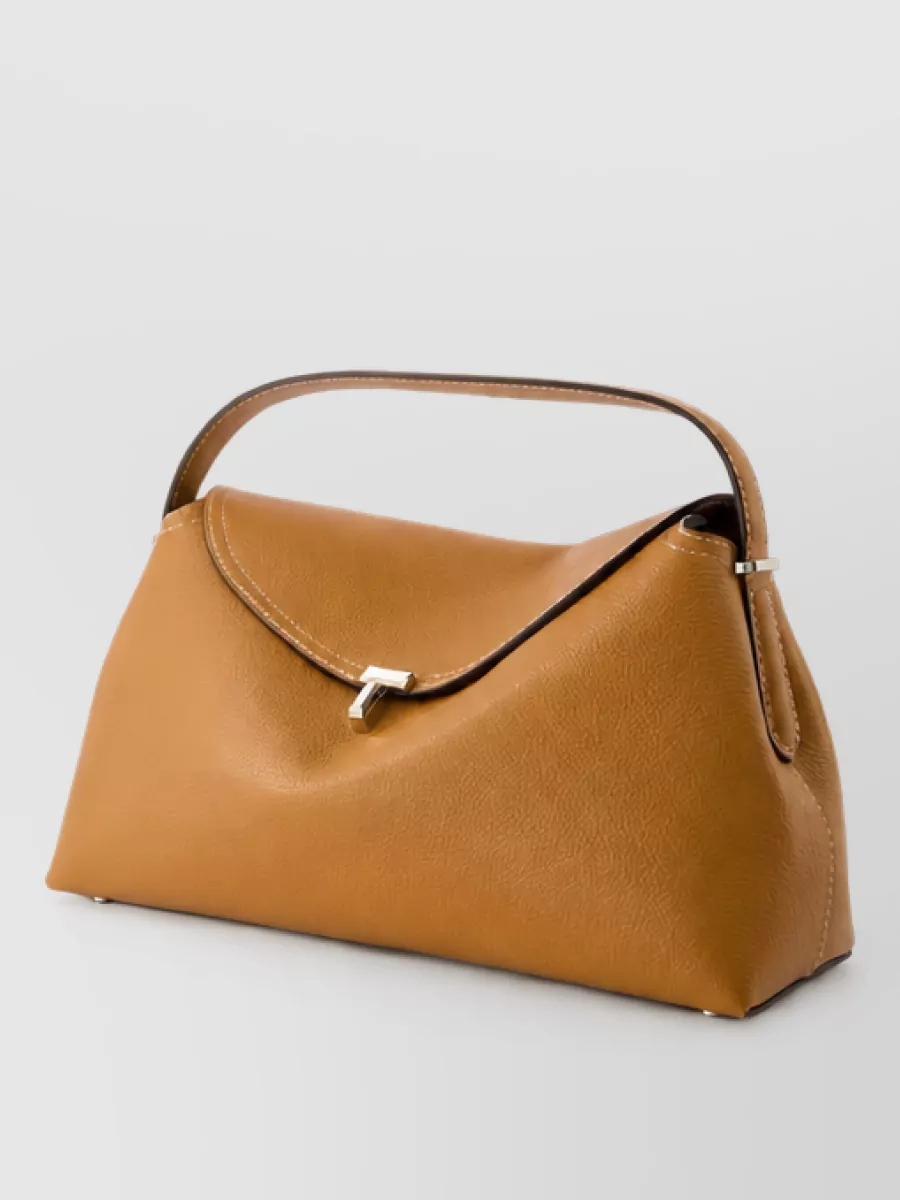 Totême leather t-lock clutch bag