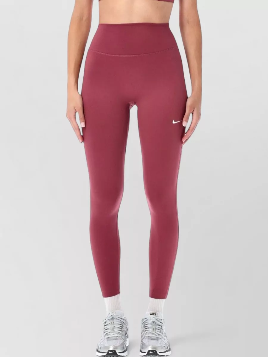 Nike High-rise 7/8 slim-fit leggings — The matching dusty berry high-waisted leggings create a clean monochrome Nike set that mirrors the bra’s color, fabrication, and second-skin silhouette for a streamlined sport aesthetic.