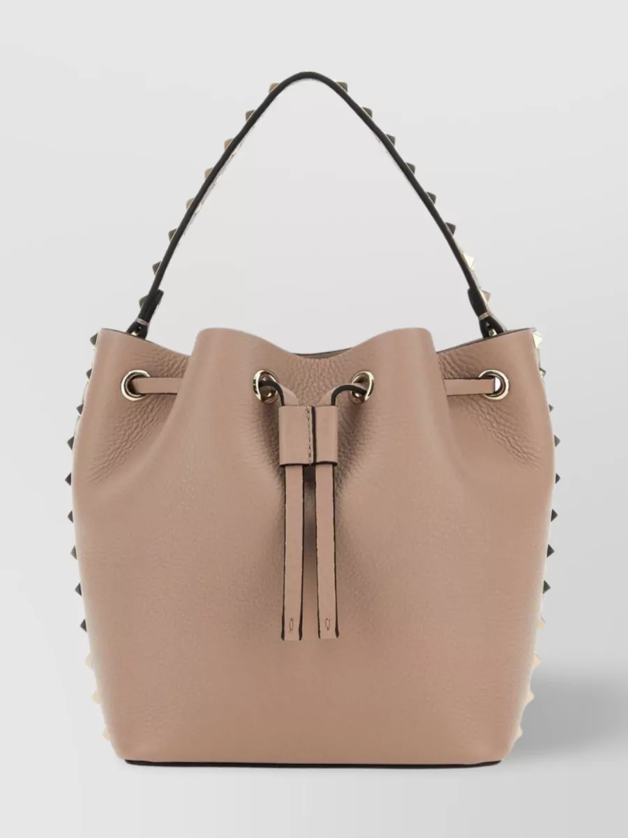 Shop Valentino Leather Bucket Bag With Stud And Tassel Accents In Beige