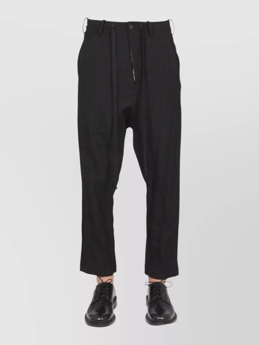 Uma Wang Cropped trousers — The cropped tapered Uma Wang trouser balances the relaxed hoodie with a sharper line and keeps everything in the same artisanal, quiet-luxury register.