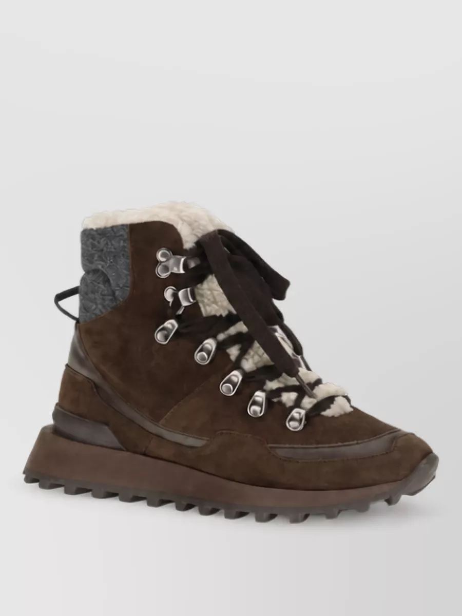Brunello Cucinelli Leather lace-up hi-top sneakers — The Brunello Cucinelli chocolate hi-top with cream and charcoal quietly ties together the sweatshirt’s black, cream, and brown palette while keeping the mood refined and winter-ready.