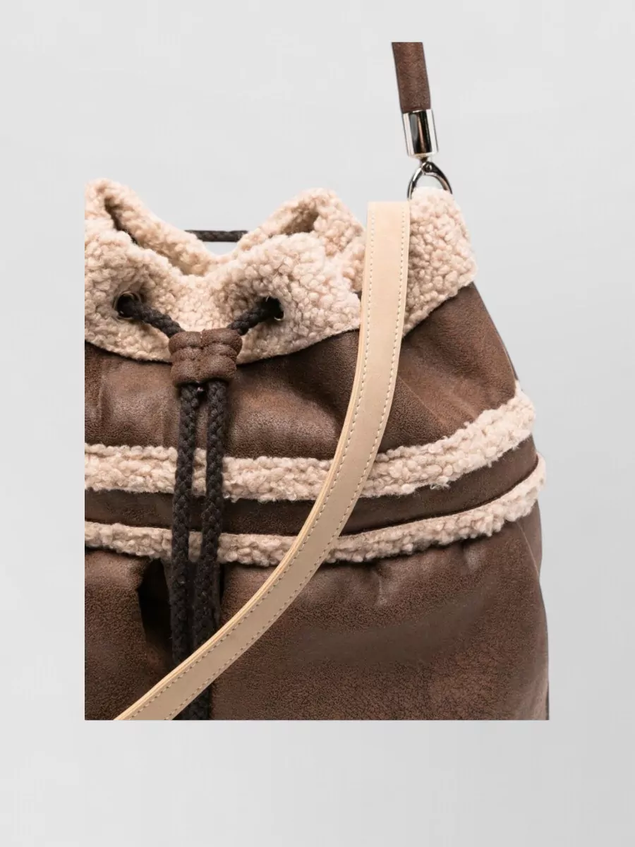 La Milanesa shearling trim bucket bag