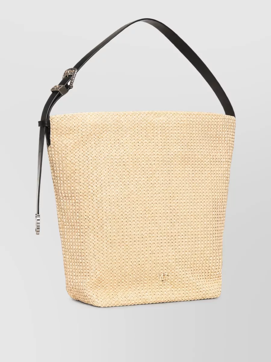 Pinko Leather beach bag — The straw-and-black bucket bag hits the brief of a chic beach tote, echoing the suggested raffia textures while tying back to the black suit for a cohesive, resort-ready pairing.