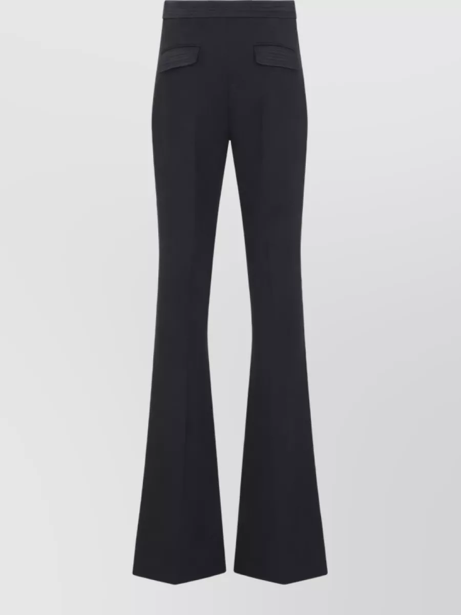Elisabetta Franchi High-rise flared trousers — The deep navy high-rise flare mirrors the blazer’s longline tailoring, creating a tonal column in the same brand language that feels quietly luxurious and elongating.