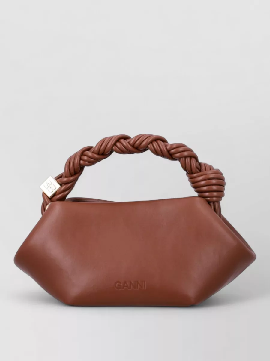 Ganni bou mini leather shoulder bag — The sculptural chestnut shoulder bag matches the brown notes in the boots and sweatshirt, adding a slightly more polished counterpoint to the playful top without overwhelming the branding.