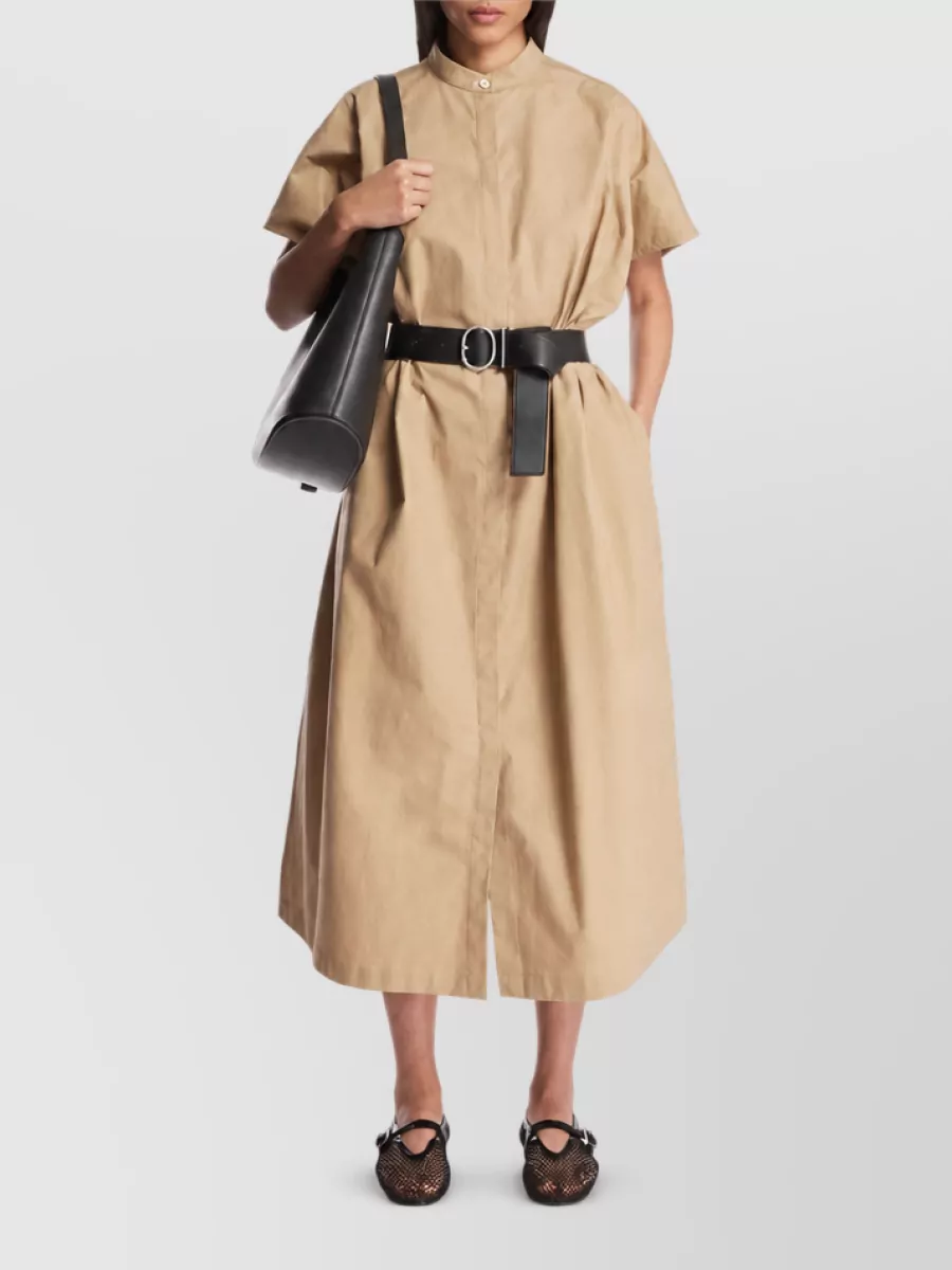 Jil Sander Cotton midi dress — The sand-beige Jil Sander belted midi shirt dress mirrors the bag’s warm camel tones, matches its quiet luxury polish, and gives a streamlined day-to-dinner base that suits the bag’s informal-meeting brief better than suiting separates.