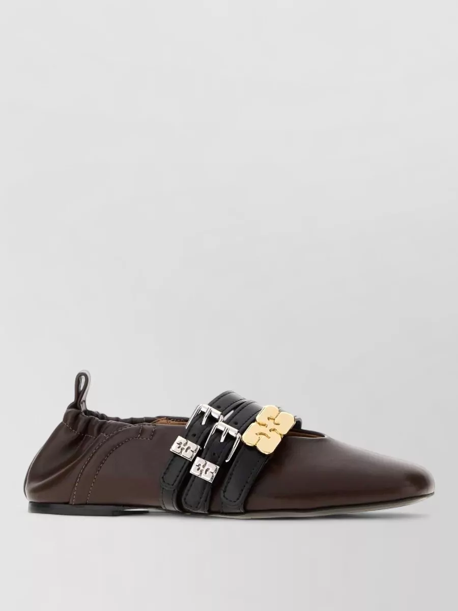 Ganni Synthetic leather ballerinas — The croc-embossed dark brown loafers sit in the same tailored-preppy and quiet-luxury space as the waistcoat and trousers, keeping the silhouette sharp yet walkable for daytime.