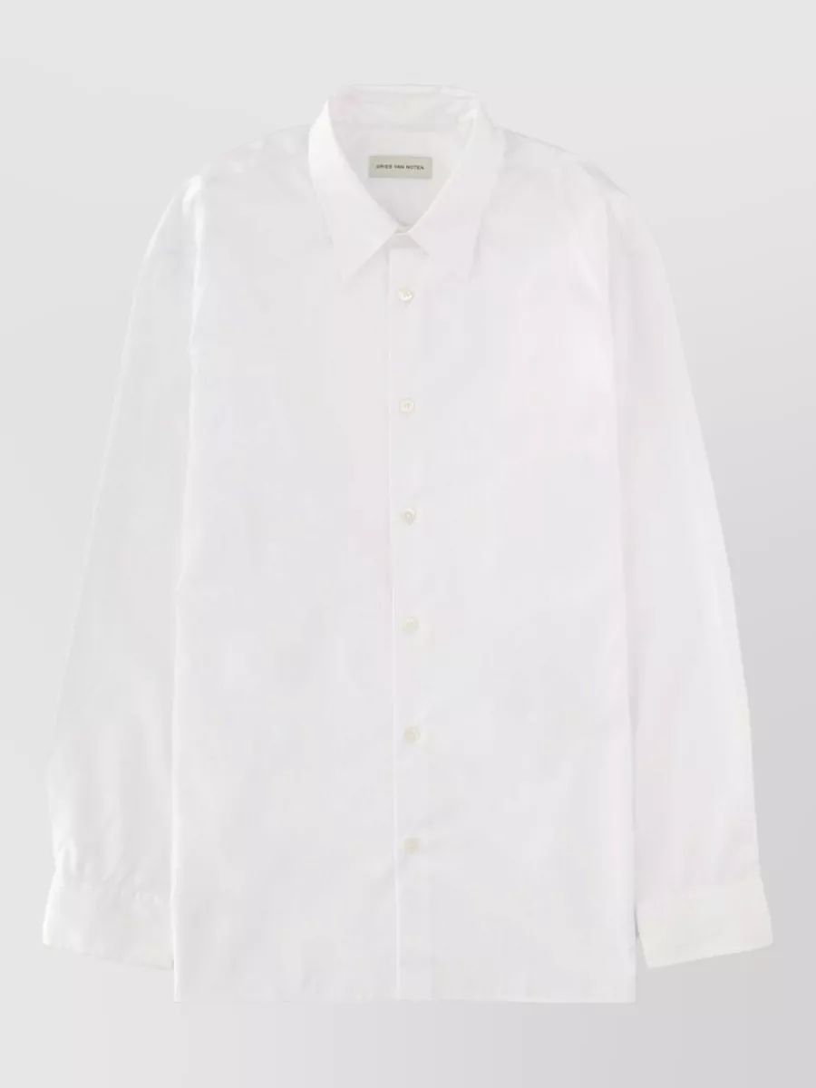Dries Van Noten Cotton shirt — The crisp Dries Van Noten white shirt matches the trousers’ quiet luxury and formality, keeping the palette light and refined while balancing the wide leg with a clean, straight upper block.