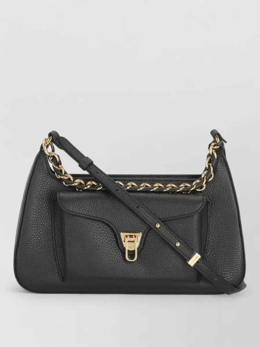 Coccinelle Leather shoulder bag — The Coccinelle black shoulder bag with subtle gold hardware keeps to the black palette, stays structured like the cardholder, and introduces just a hint of jewelry-like shine.