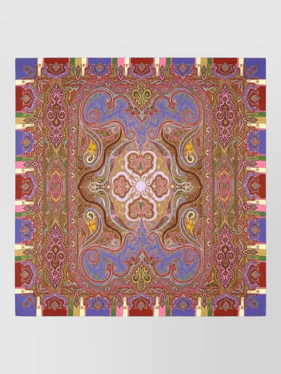Etro Silk wool scarf — The Etro scarf in orchid, terracotta and antique gold can be worn loose or as a wrap, picking up the shirt’s purples and warm tones while adding a soft, bohemian frame without extra sparkle.
