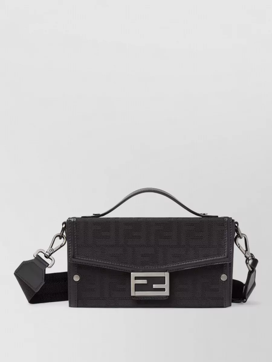 Fendi baguette nylon jacquard cross-body bag — The structured charcoal-black mini with brushed silver hardware riffs on the skirt’s dark, graphic mood and feels modern and nocturnal without overpowering the look.