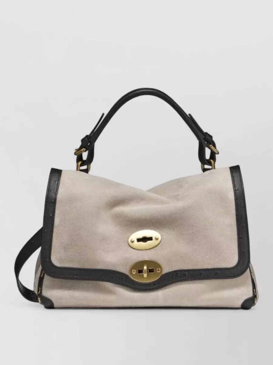 Zanellato Lamb leather shoulder bag — The dark chocolate Zanellato top-handle introduces subtle contrast and texture while staying structured and quietly luxurious, harmonising with navy tailoring and the minimalist palette.