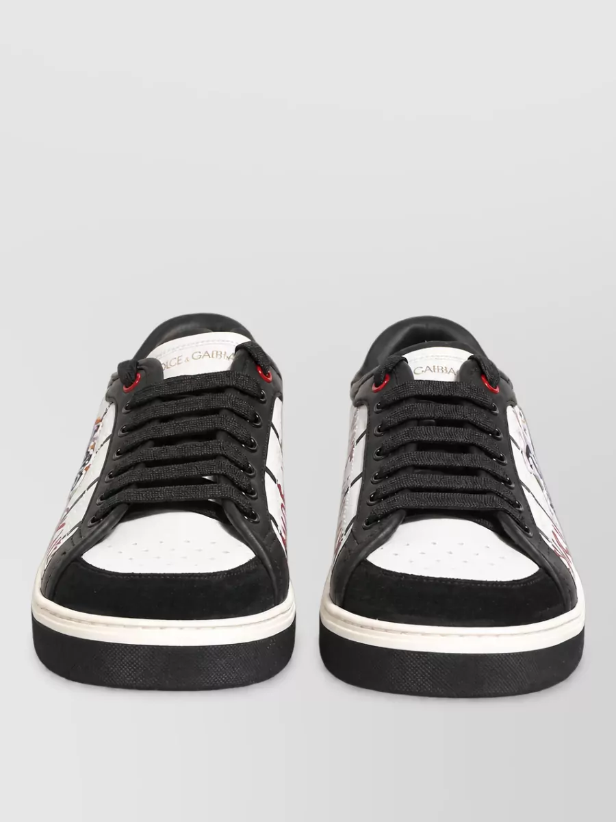 Dolce&Gabbana Calf leather logo low-top sneakers — Sneaker H ties directly into the tee’s white, black and red palette, giving a cohesive graphic court-inspired base that feels street but still polished.