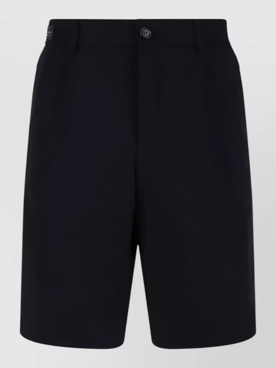Paul & Shark Tailored bermuda shorts — The light beige straight-leg chinos in K sharpen the navy tee with a clean preppy contrast that suits warm-weather casual while keeping the overall feel minimal and subtly nautical.