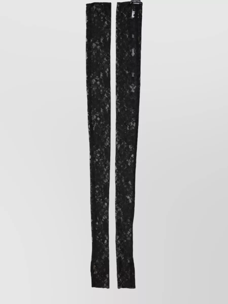 Dolce&Gabbana Floral lace arm warmer sleeves — The Dolce & Gabbana black lace tube scarf plays into the dark romantic, slightly 90s mood and can be draped lightly without obscuring the dress’s texture.