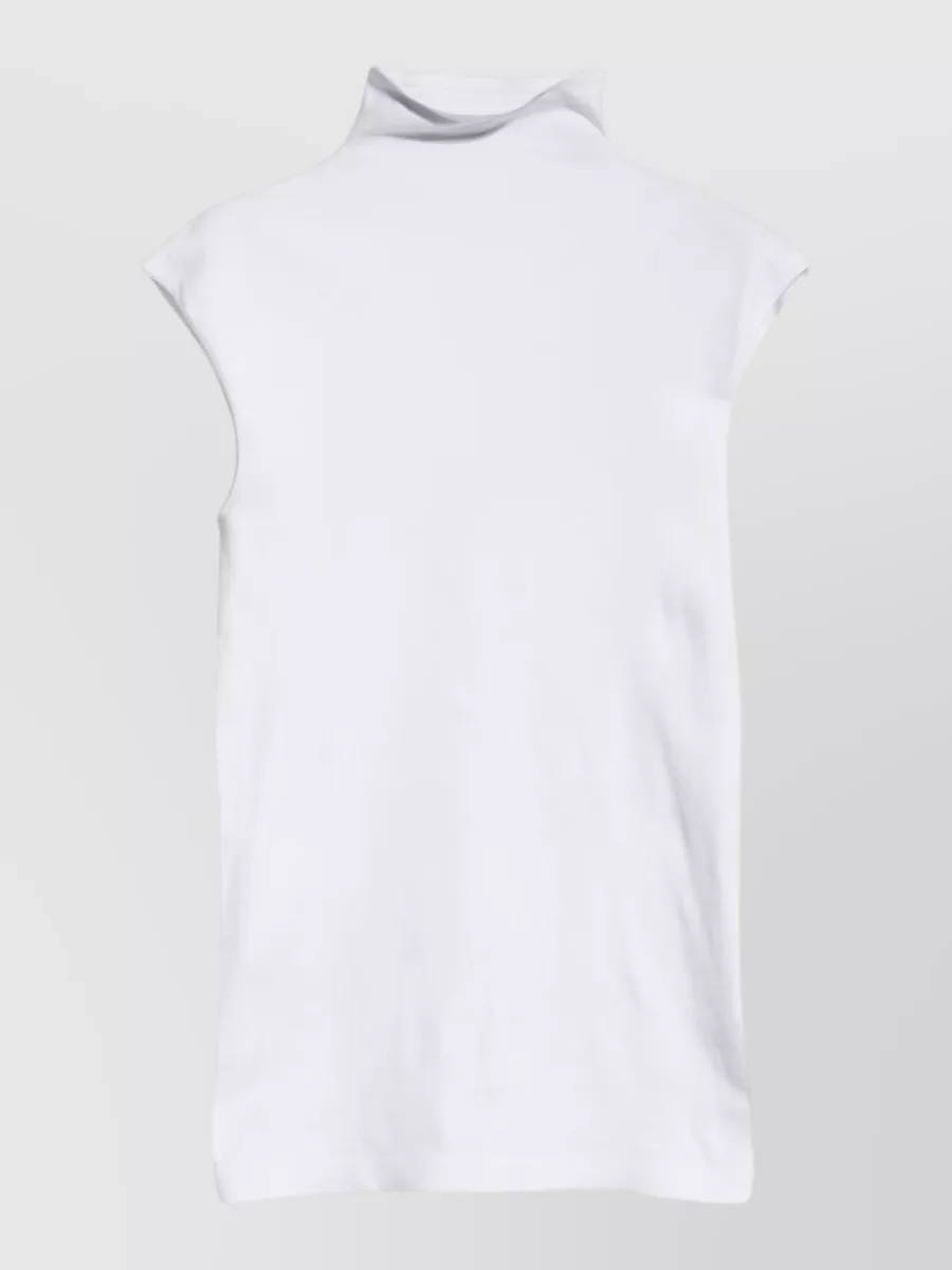 Gucci Seamless stretch turtleneck sleeveless top — The fitted white mock-neck mirrors the skirt’s sleek line and keeps the all-over monogram grounded and clean, in line with the source’s preference for fine, body-skimming knitwear.