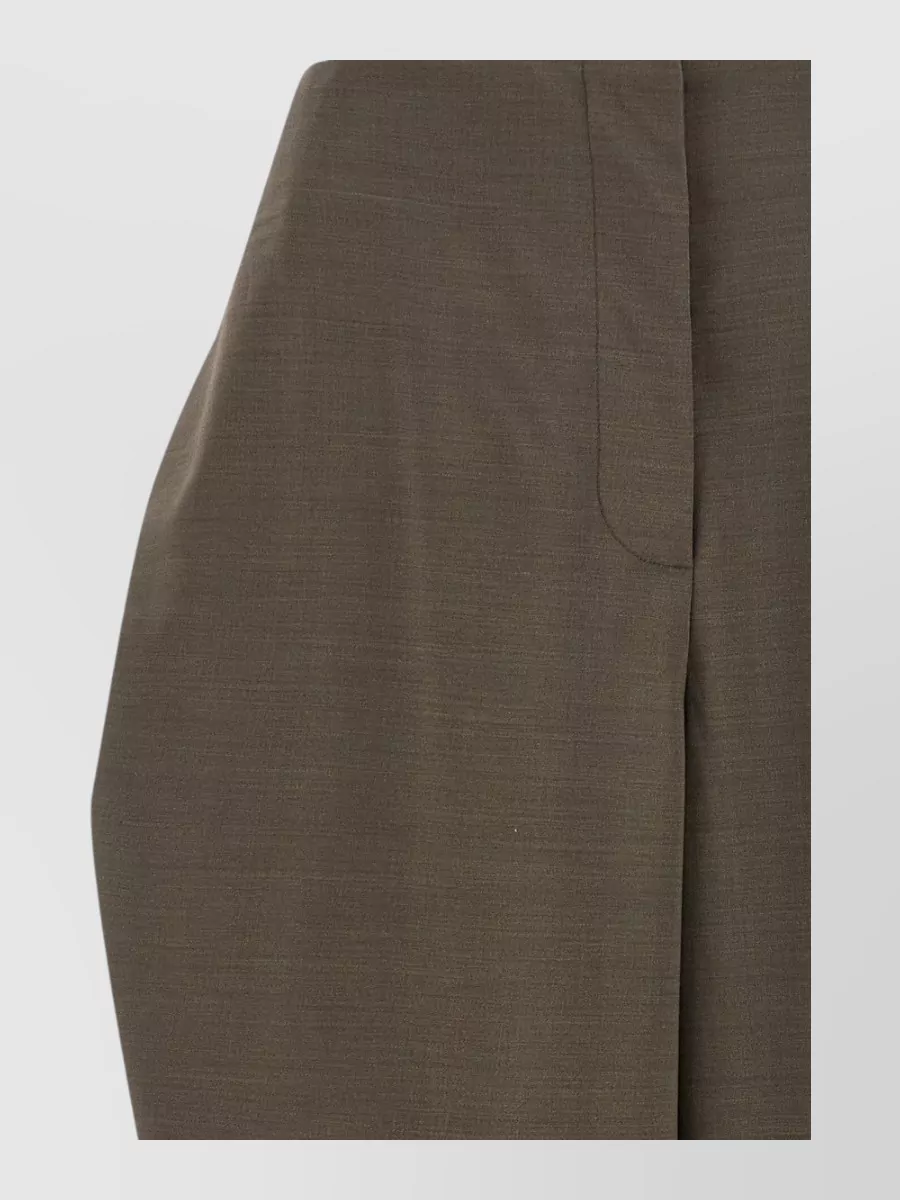 Jacquemus Virgin wool high-rise wide-leg tailored trousers — The high-waisted relaxed olive-brown trouser mirrors the knit's taupe warmth, keeps the palette tonal, and its soft volume balances the regular-fit jumper for refined day dressing.