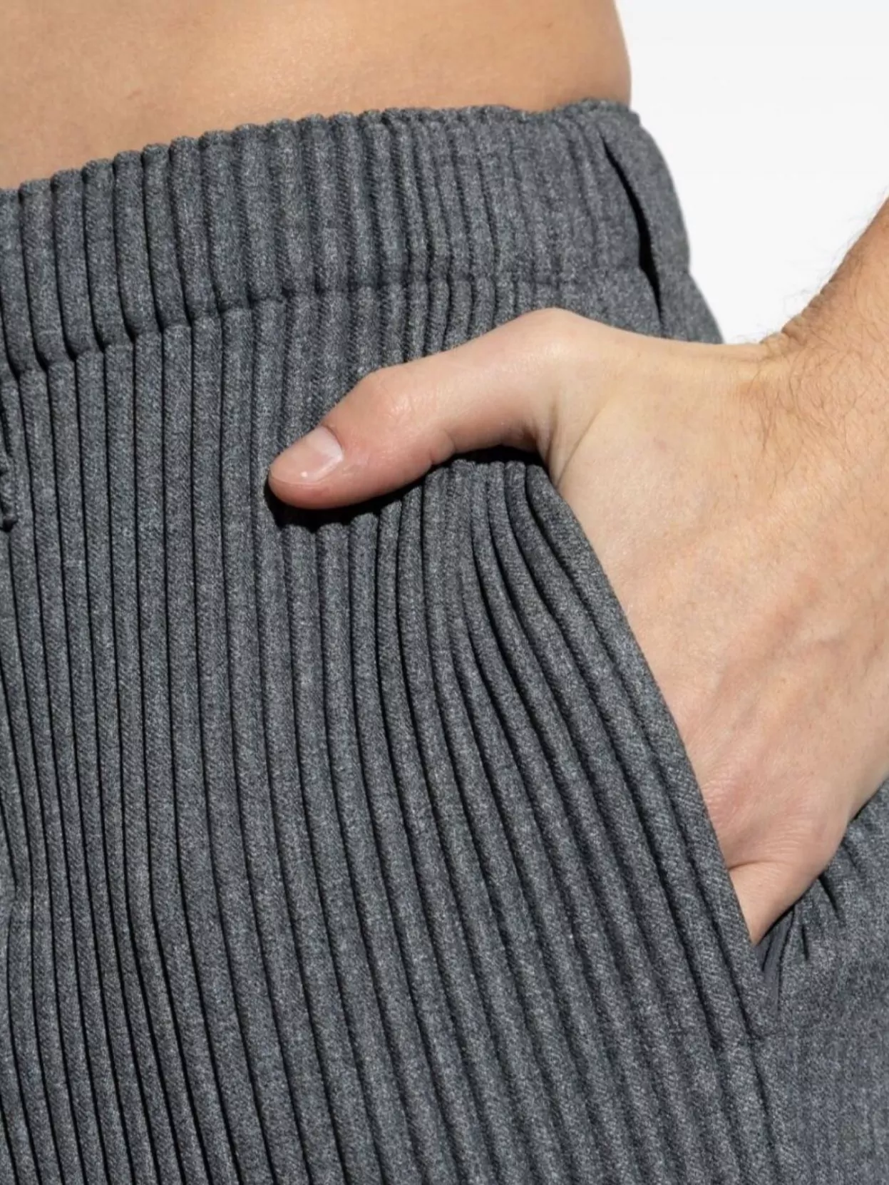 ISSEY MIYAKE PLEATED TROUSERS WITH ELASTICATED WAISTBAND AND RIBBED TEXTURE