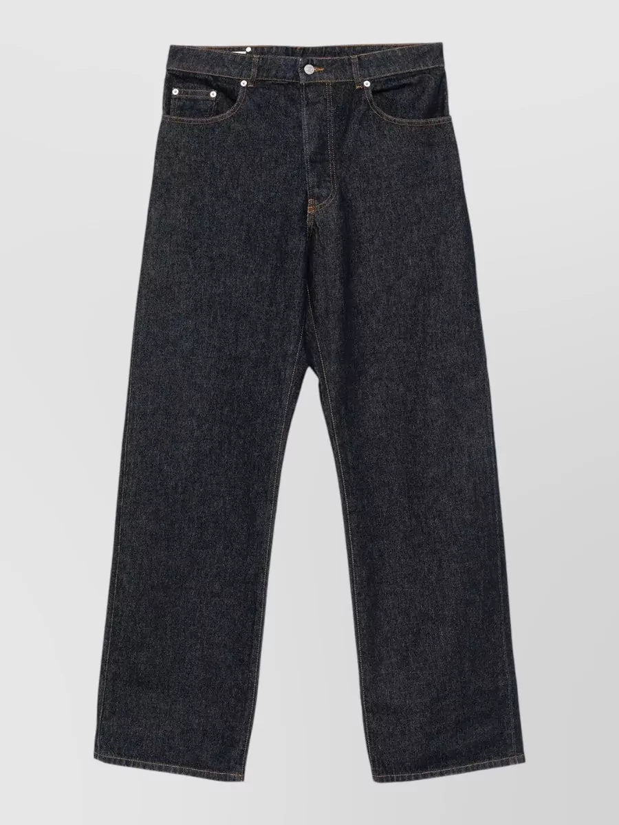 Dries Van Noten Cotton straight-leg jeans — The dark indigo wide-leg denim is exactly what the jacket wants, giving a clean architectural line and weight that grounds both the texture and print in an artful, street-leaning way.