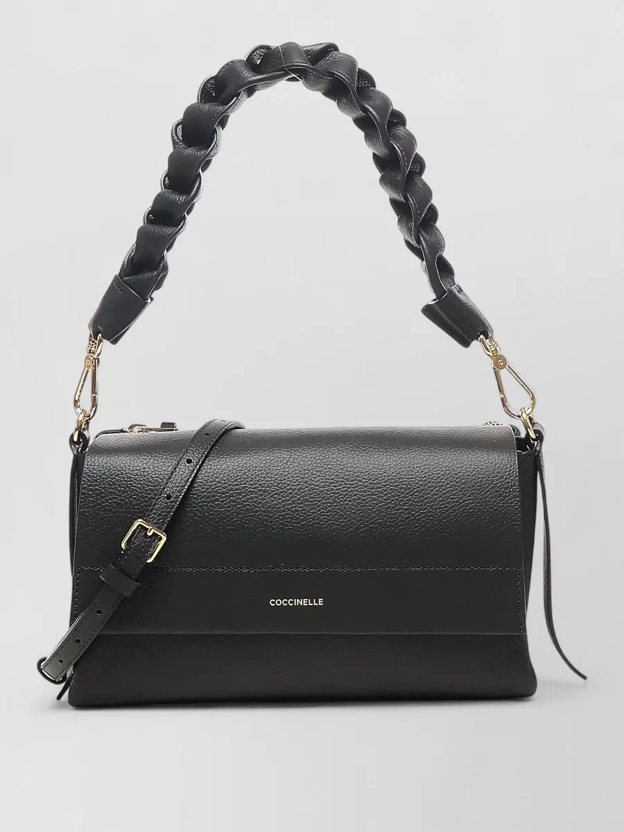 Coccinelle Leather shoulder bag — Coccinelle’s black structured flap bag echoes the loafer’s tone and hardware, adding a refined, office-appropriate counterpoint to the camel tailoring while staying within the same understated luxury bracket.
