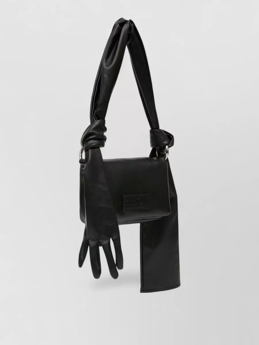 Mm6 Maison Margiela glow belt bag — The Mm6 sculptural belt bag with detachable gloves leans into the same conceptual streetwear energy as the sneakers while keeping the silhouette close to the body and graphic.