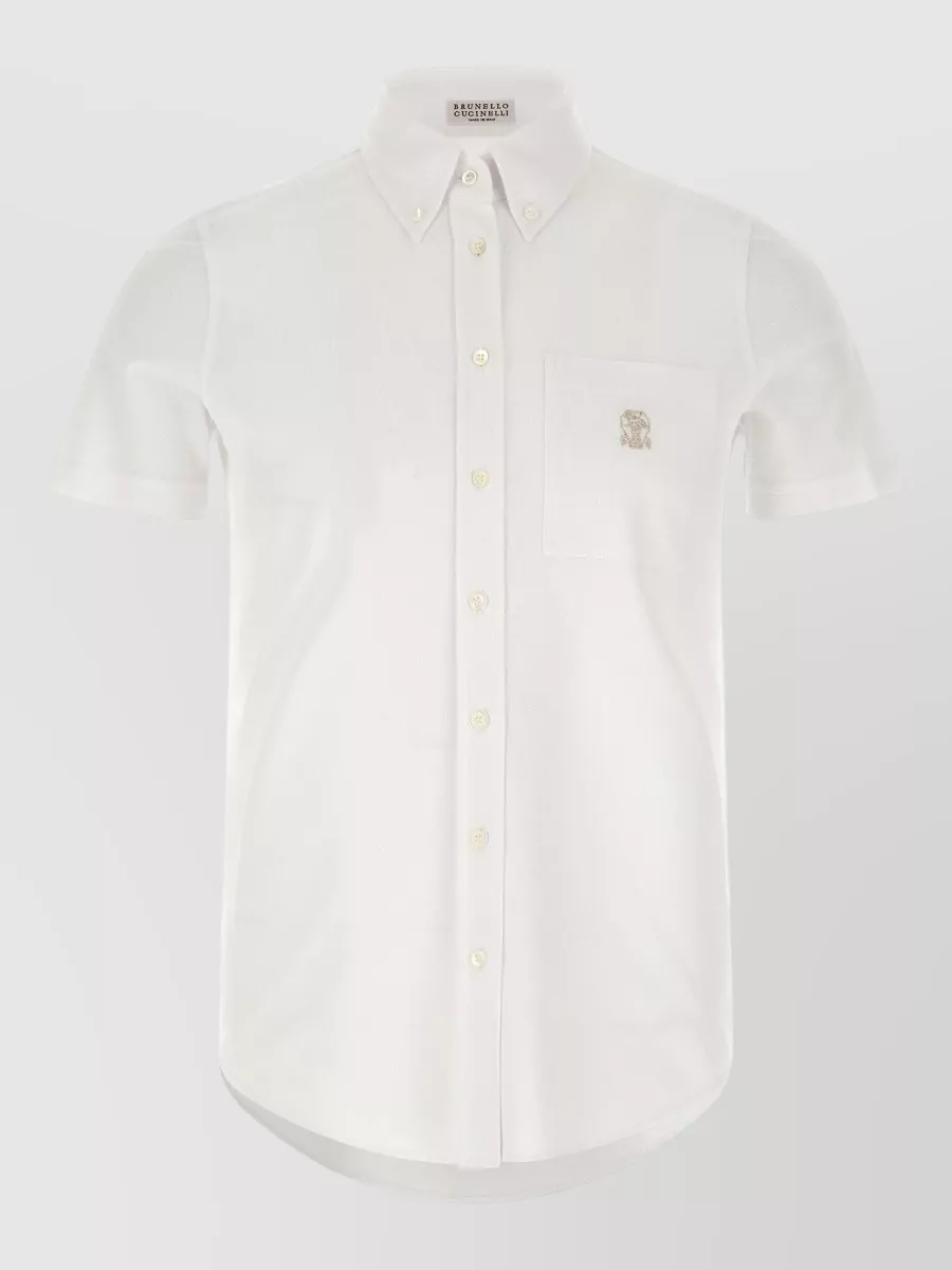 Brunello Cucinelli Cotton shirt — The crisp soft‑white short‑sleeve Brunello shirt balances the bold floral shorts with clean minimalism, keeps the look SS‑breezy, and lets the rust print stay the focus while still feeling polished and luxurious.