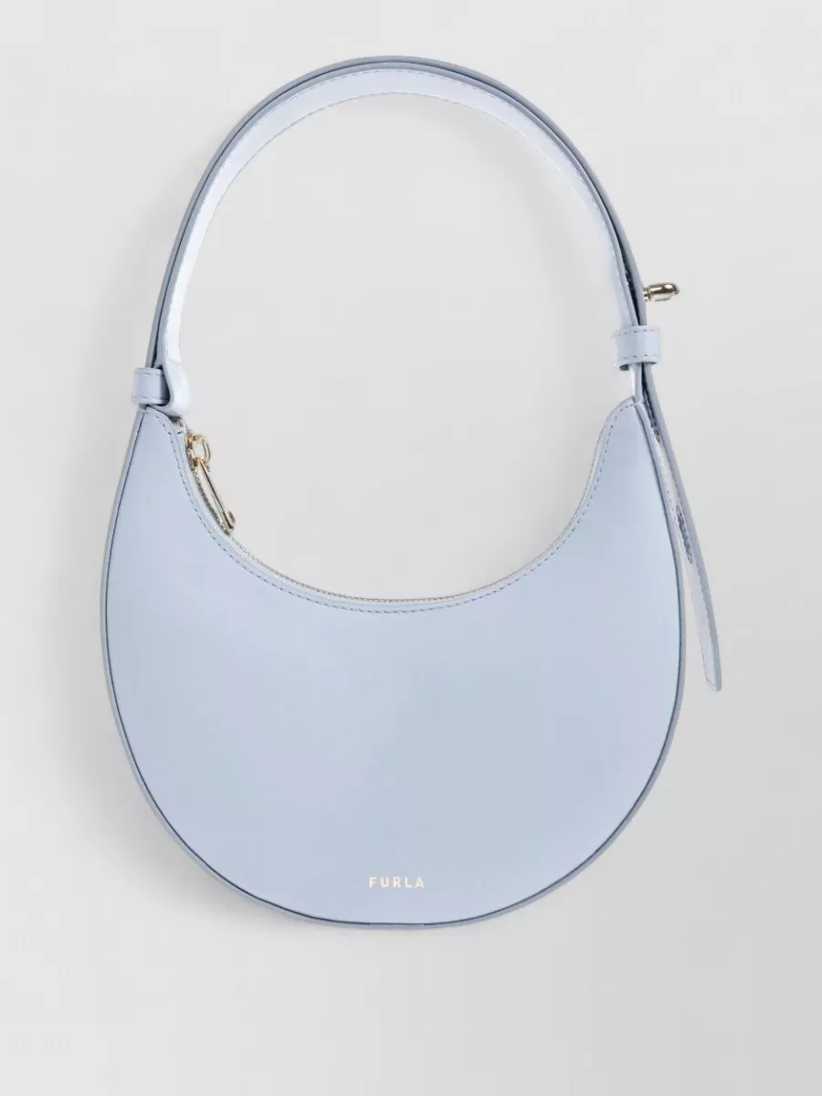 Furla 1927 leather shoulder bag — The small powder-blue Furla hobo subtly echoes the cardigan’s tone, adding a clean, modern accent that keeps the colour story soft and cohesive without competing with the silhouette.