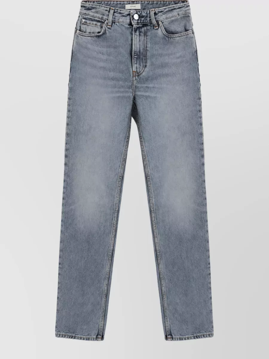 Totême High-rise straight-leg tapered denim jeans — The Totême washed grey-blue straight jeans keep the mood casual and minimalist, echo the tee’s blue while adding a softly muted contrast that works for cool-weather streetwear.