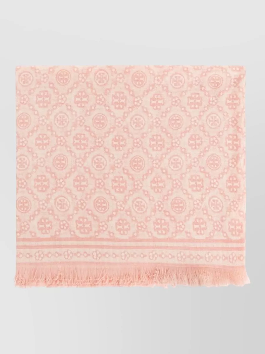 Tory Burch Wool and silk scarf — The Ferragamo forest-green silk scarf introduces a single deep accent that flatters mustard and ice blue, adding opulent depth without disrupting the soft, romantic mood.