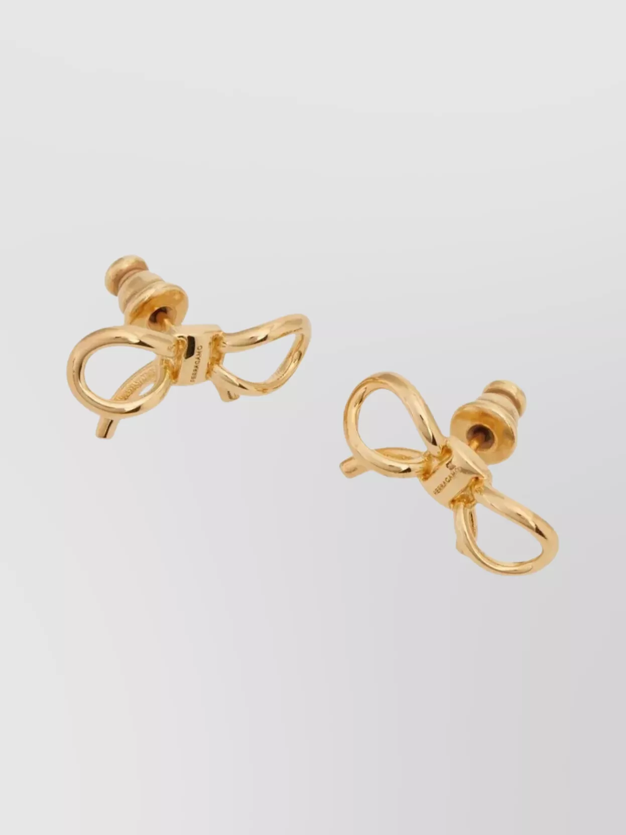 Ferragamo Stylish Bow Design Stud Earrings In Gold