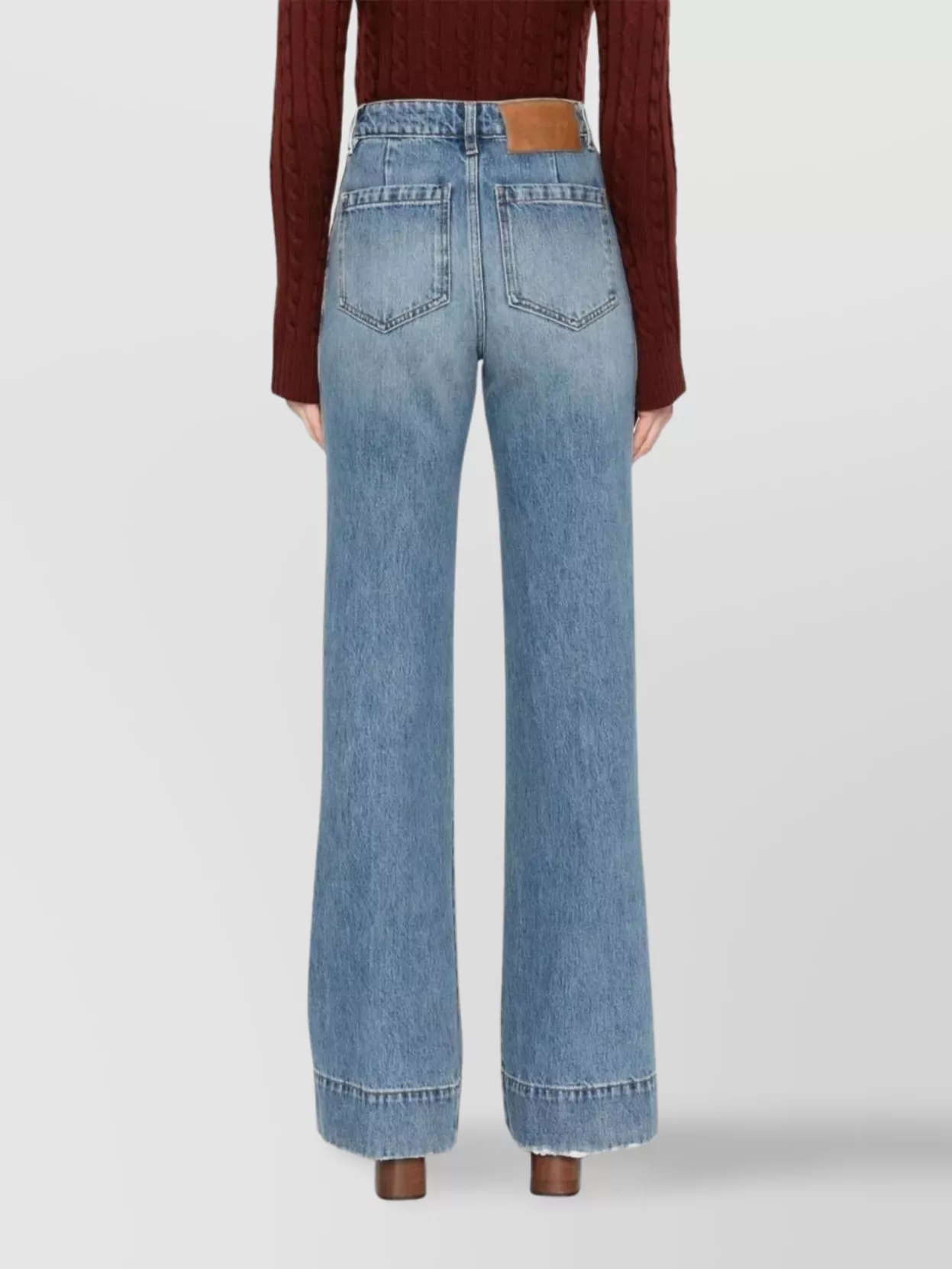 Victoria Beckham High-Rise Wide-Leg Jeans Featuring Distressed Detail