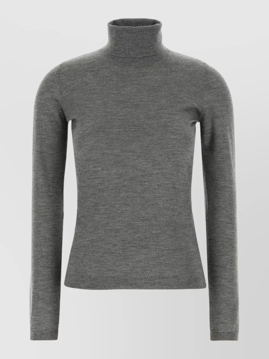 Brunello Cucinelli Cashmere silk sweater — The slim charcoal turtleneck keeps the palette tonal with the deep charcoal trouser and preserves a long, lean line that feels quietly powerful under tailoring.
