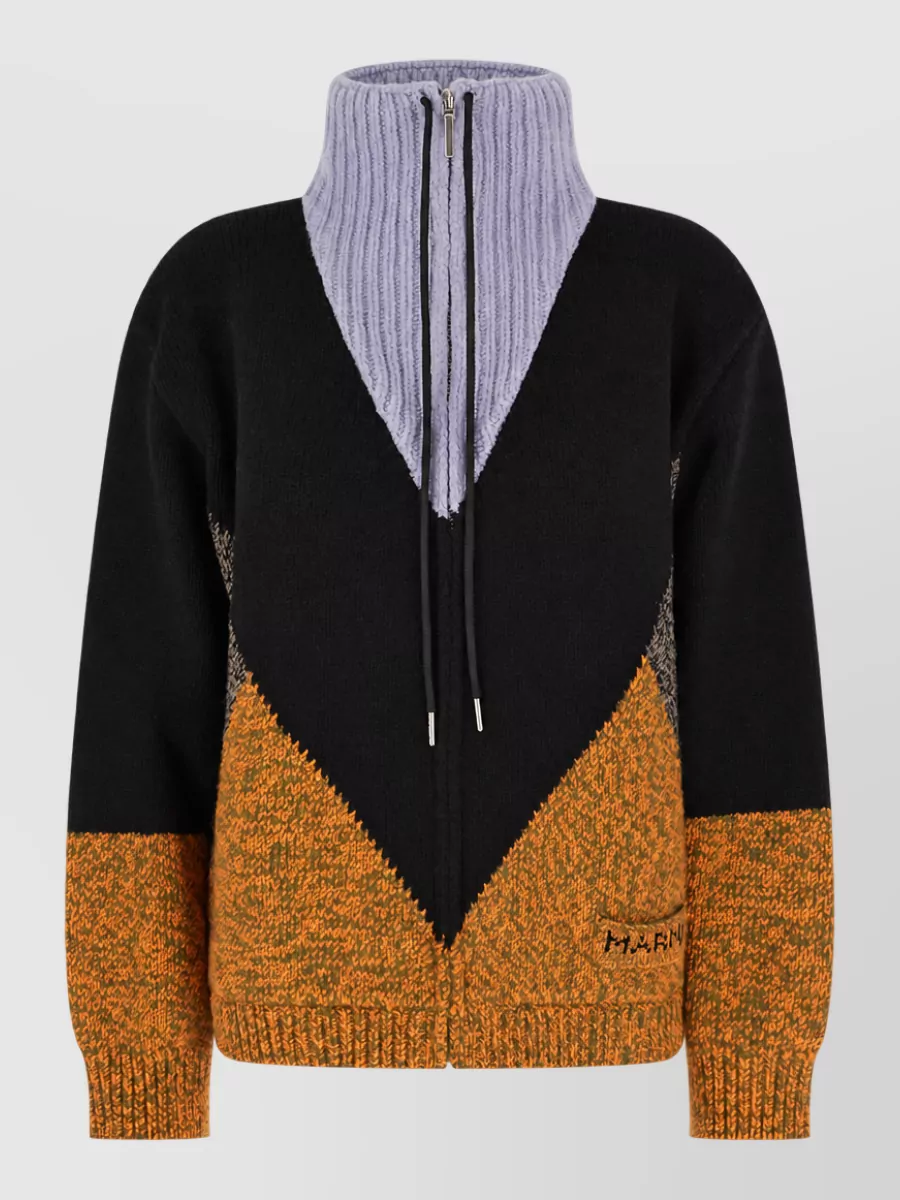 Marni Wool cashmere ribbed high neck zip up jumper — The Marni chevron zip-up mirrors the sneaker’s sport-utility attitude and olive tones while its relaxed, technical knit keeps the outfit winter-ready and visually balanced over wide cargo volumes.